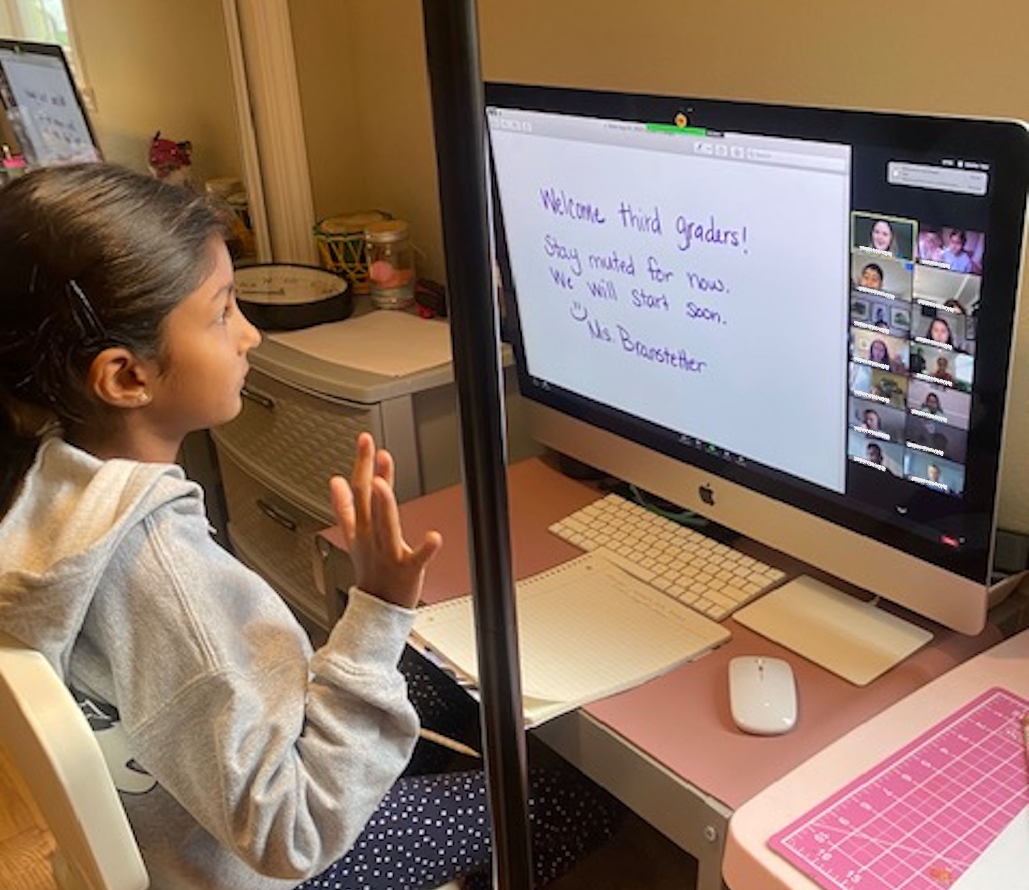 girl sitting at computer and learning at home 