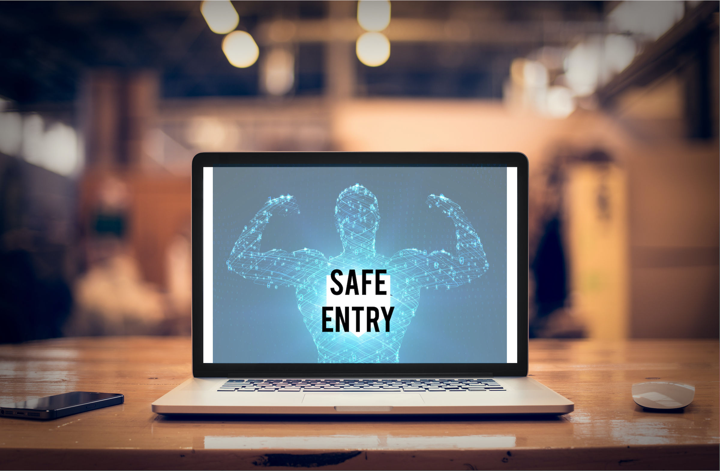 laptop with cyber strongman and words