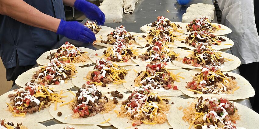 Photo of central kitchen folding burrittos