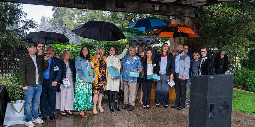 CUSD's 2026 retirees gather together in the rain for a retirement celebration