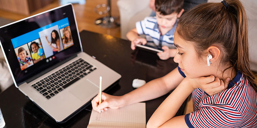 girl does school work at home