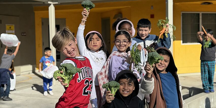students posting for power of broccoli picture.