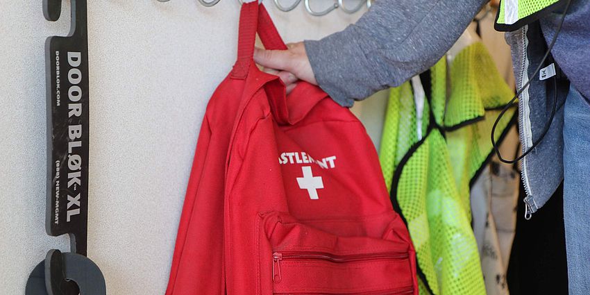 hand reaching for emergency backpack
