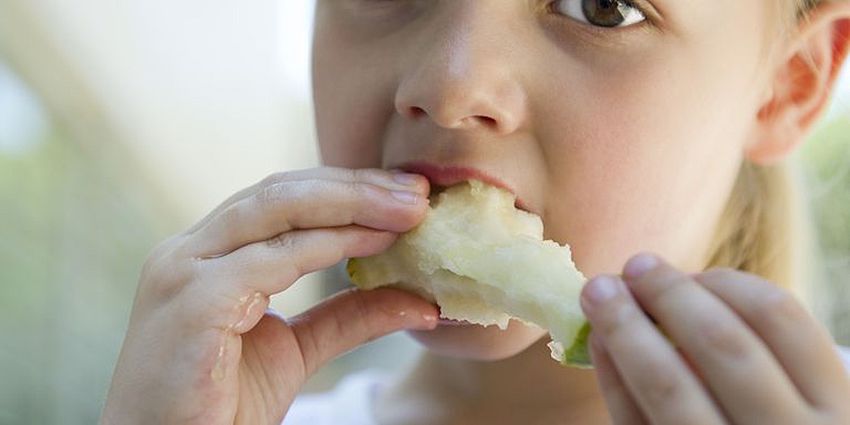 girl eating fruit