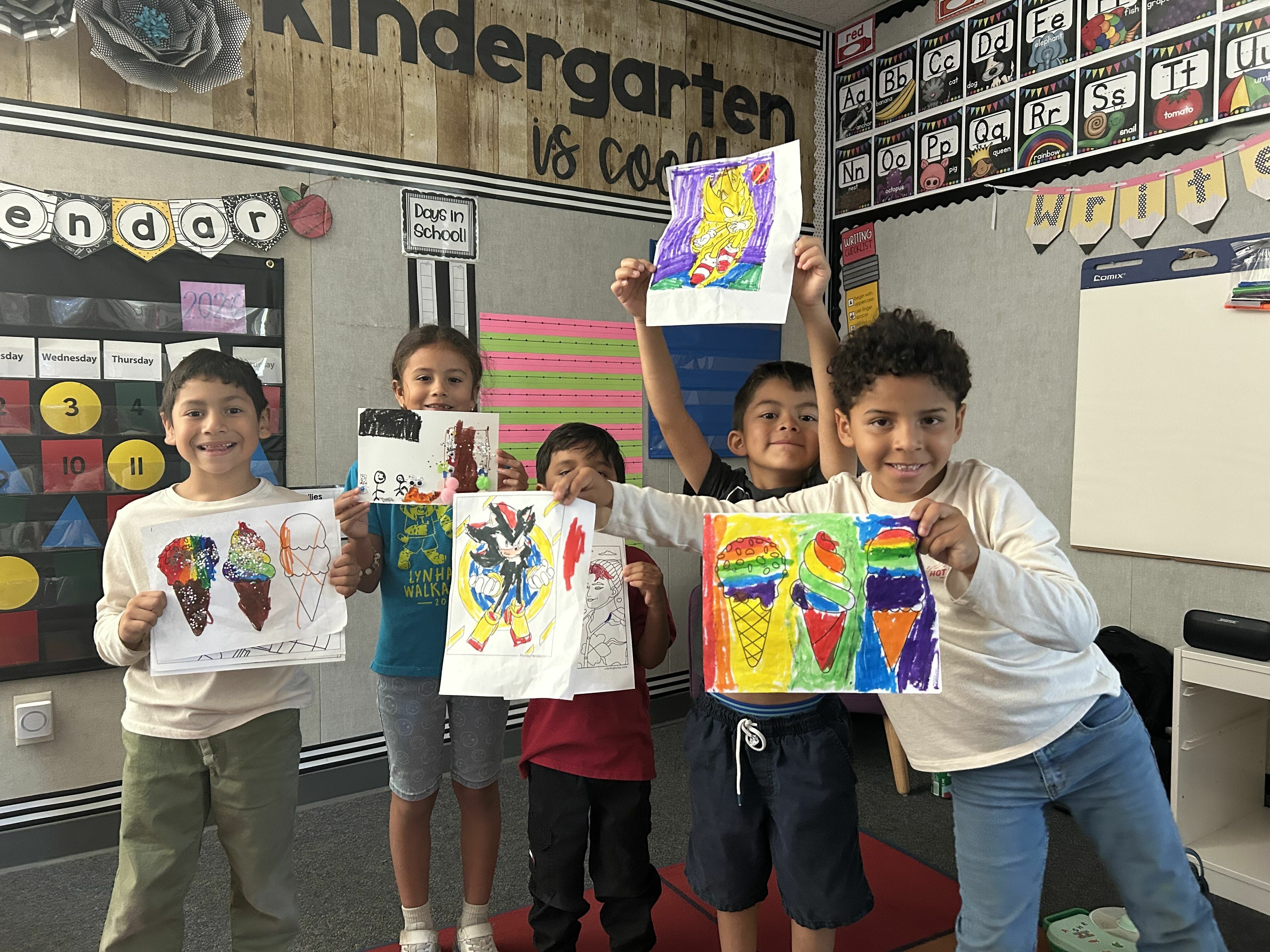 Students show off their colorful artwork