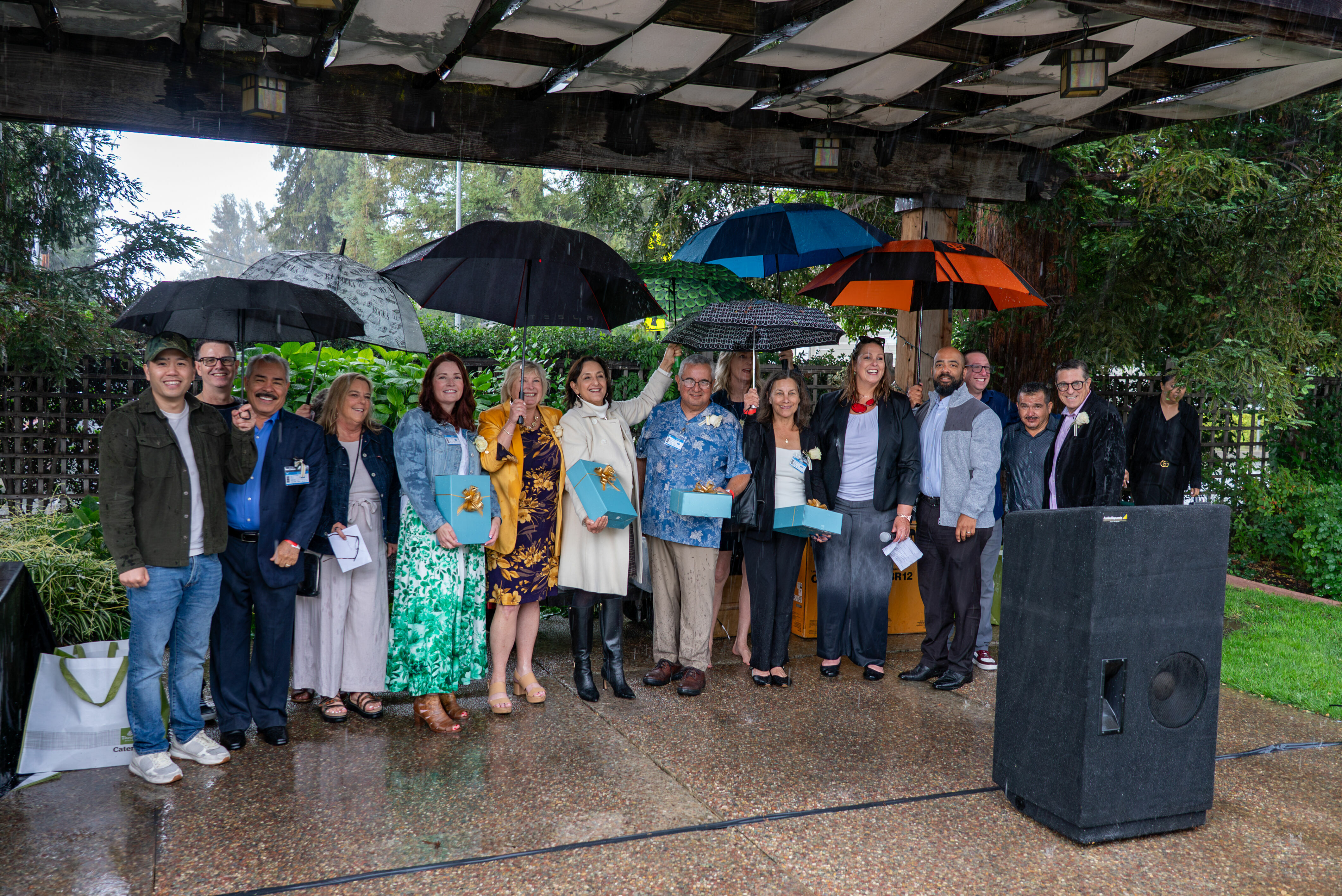 CUSD's 2026 retirees gather together in the rain for a retirement celebration
